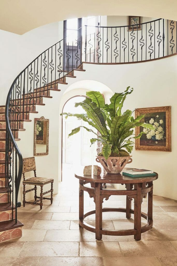 Spanish-style lobby with curved ladder